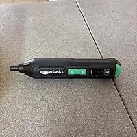 Amazon Basics cordless electric screwdriver on the garage floor